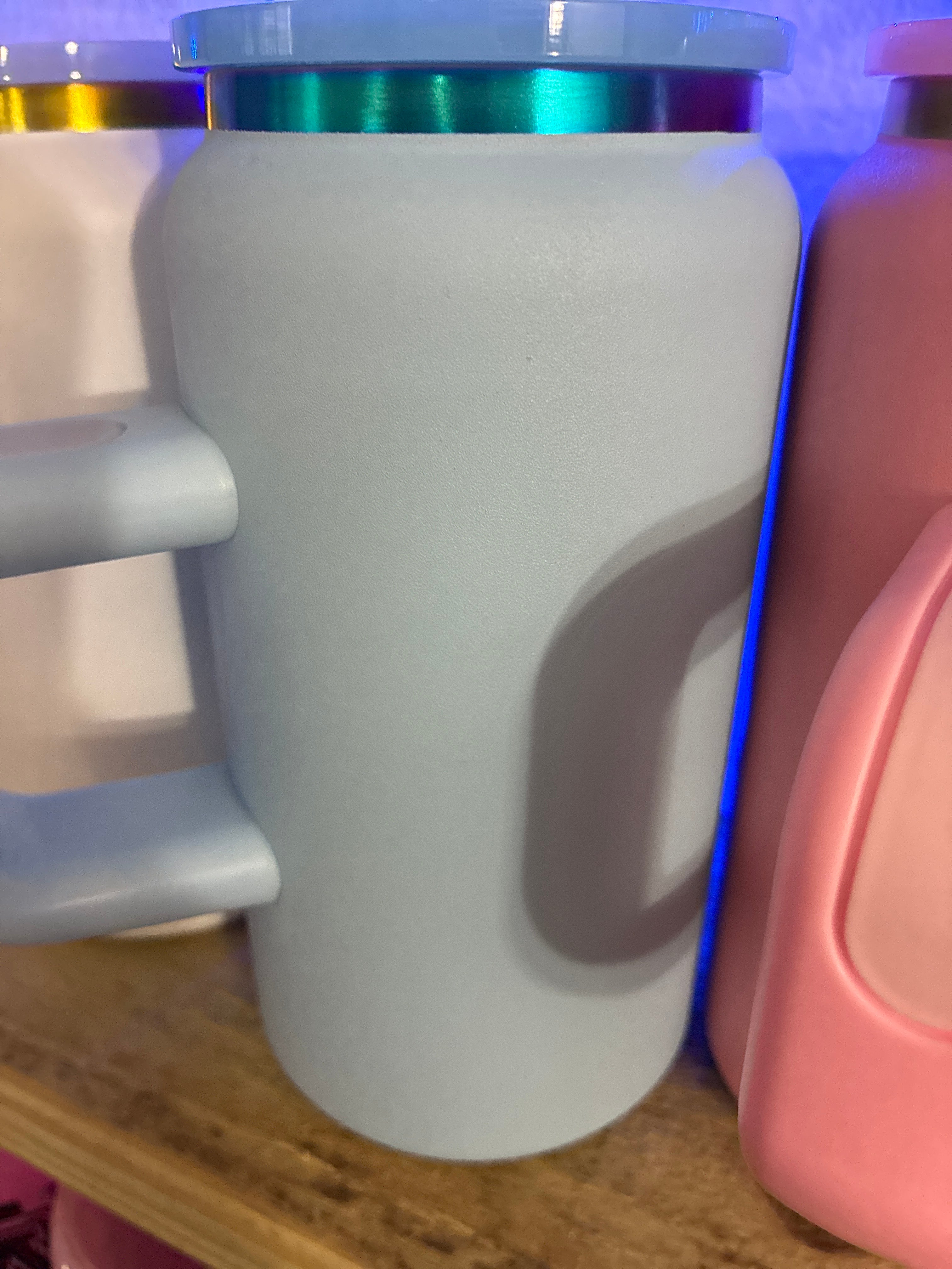 Light blue stainless steel cup with handle