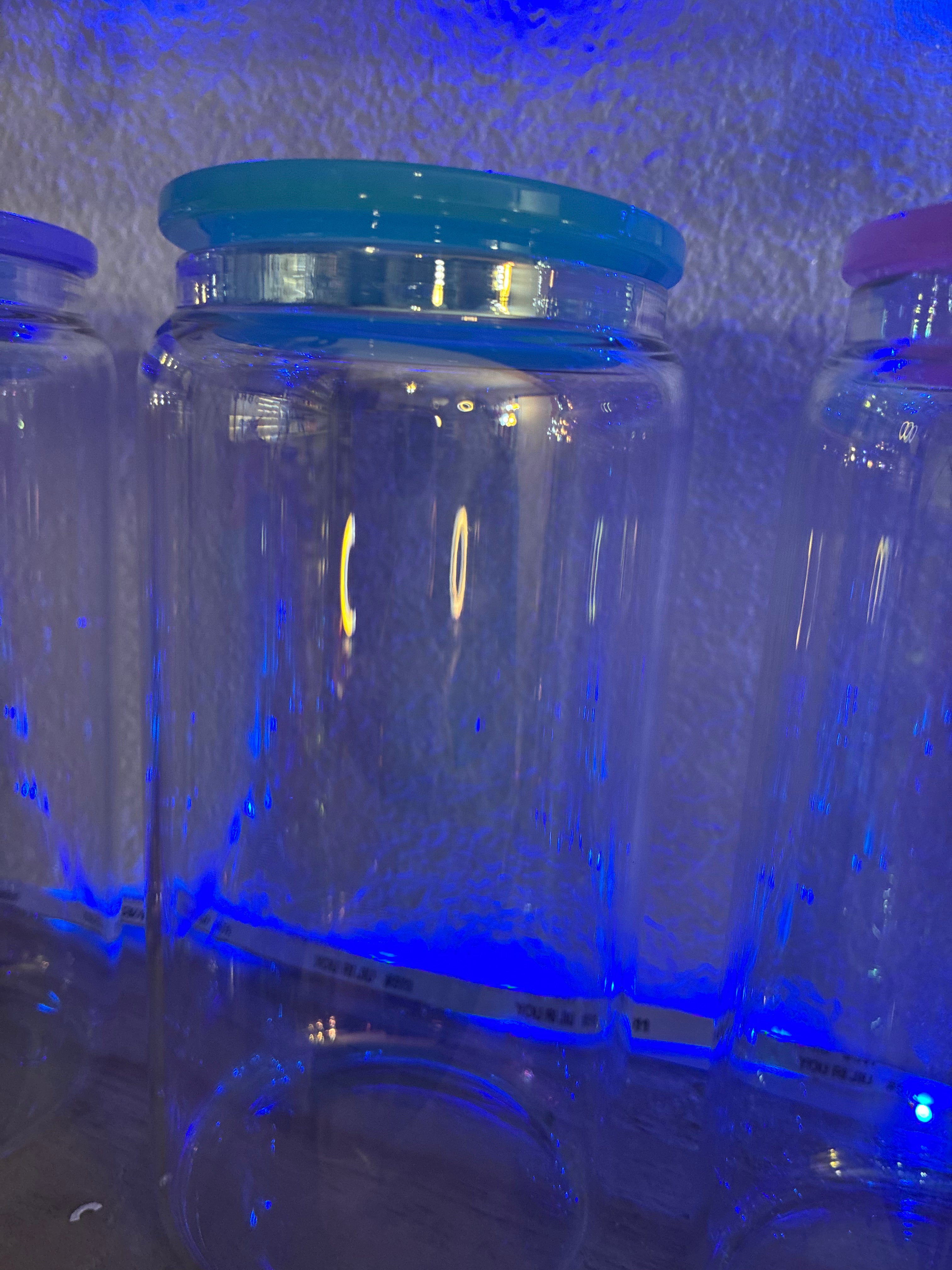 Teal lid iridescent glass cup