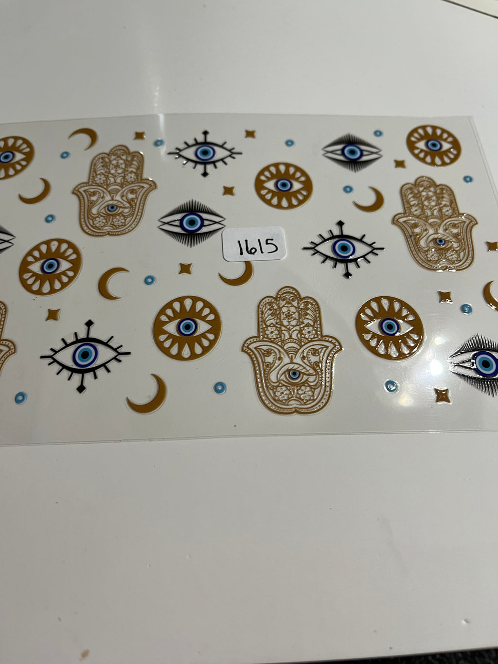 Gold evil eye 1615